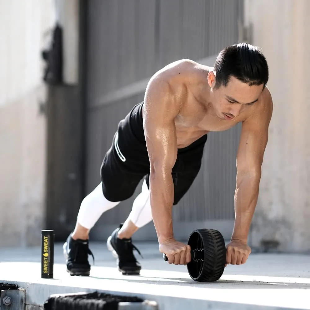 Person using ab wheel roller